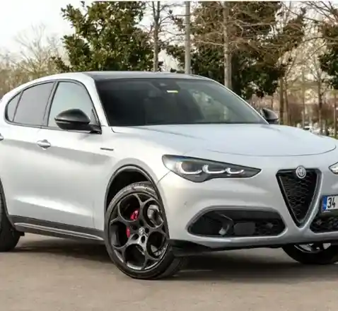 Modern Alfa Romeo SUV featuring signature triangular grille and sharp headlight design